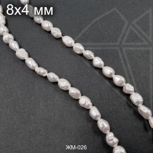 Жемчуг майорка белая 8х4 мм 0,5 нити
